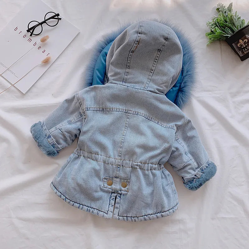 Blue denim coat for a girl with a non-removable hood and pink lining visible.