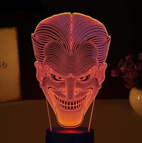 USB-powered 3D LED lamp showing multiple colours on an acrylic panel with a remote control.