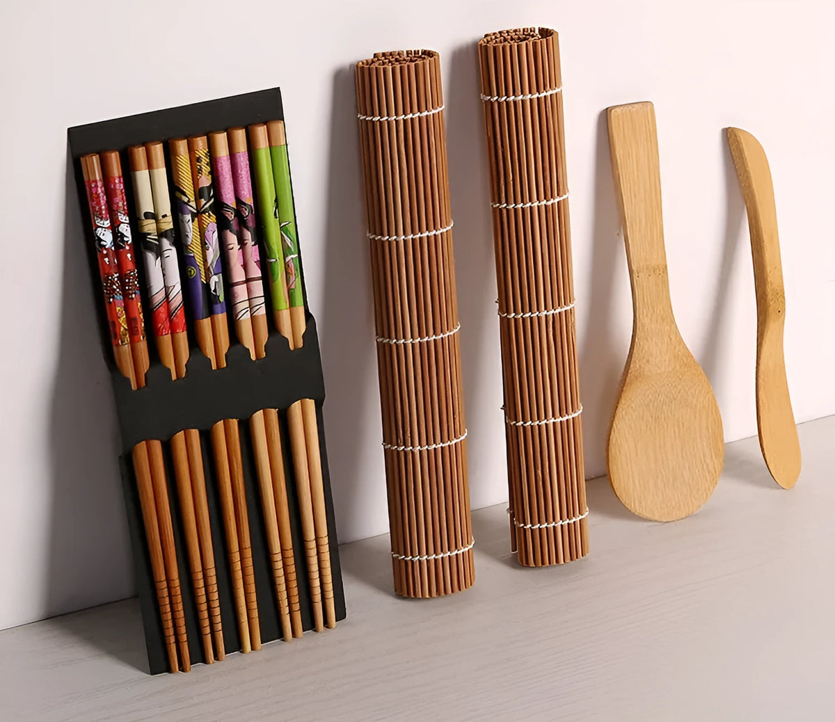 Sushi tool set with bamboo rolling mat and white plastic rice paddle for home sushi making