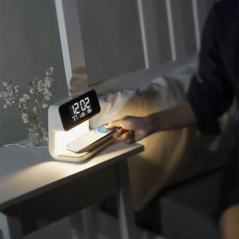 White 3-in-1 bedside lamp with wireless charging pad, LCD screen clock, and touch dimming.