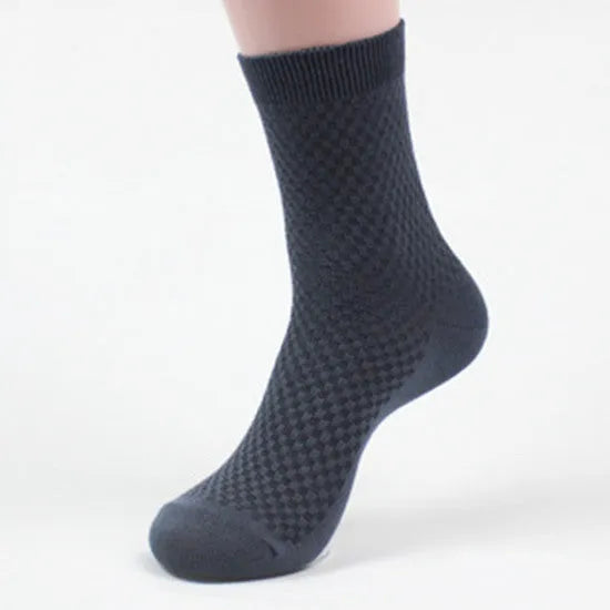 Men's bamboo fibre crew sock with small square pattern in black, navy, grey, and grey-blue colours.