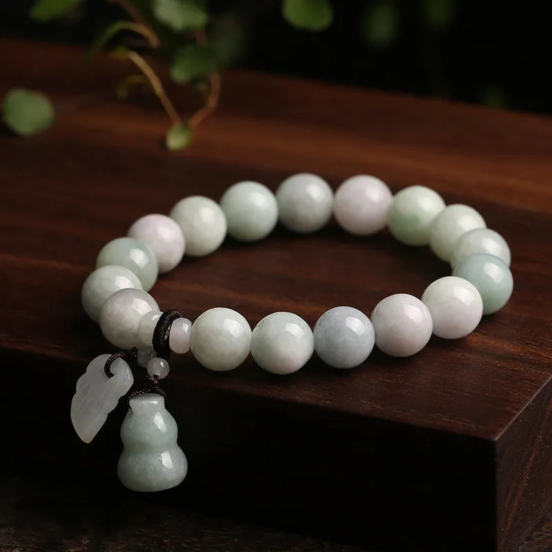 Natural jade bracelet with a choice of hanging charms: apple, double apple, money bag, gourd, or Maitreya Buddha.