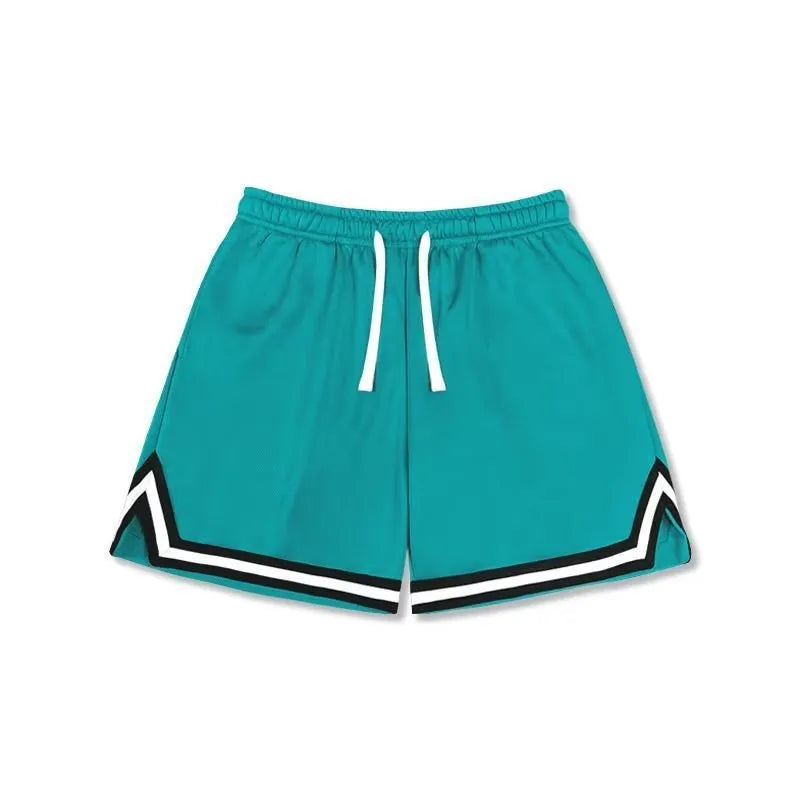 Man wearing loose grey polyester sports shorts with an elasticated waistband.