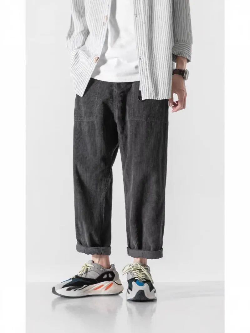 Loose straight tapered trousers with wide legs in dark grey, black, and khaki colours