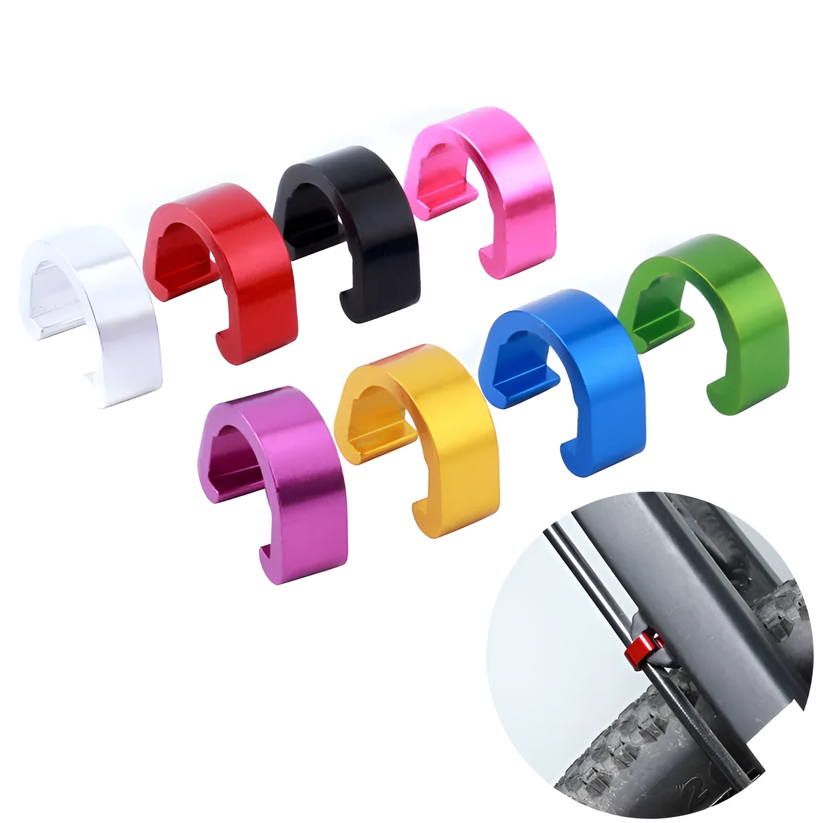 Set of ten small aluminium alloy C-shaped buckles in various colours on a white background.
