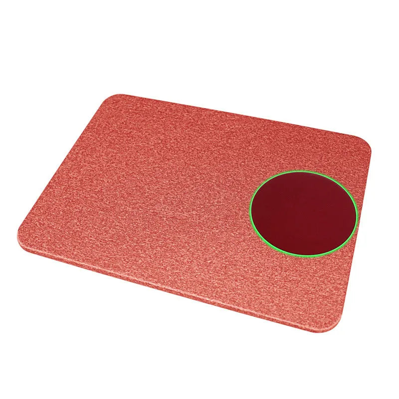 Wireless charging mouse pad on desktop showing black colour option with smartphone charging