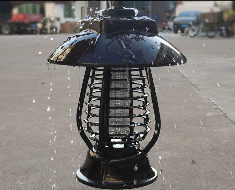 Black solar-powered electronic mosquito lamp with solar panel on top for outdoor garden use.
