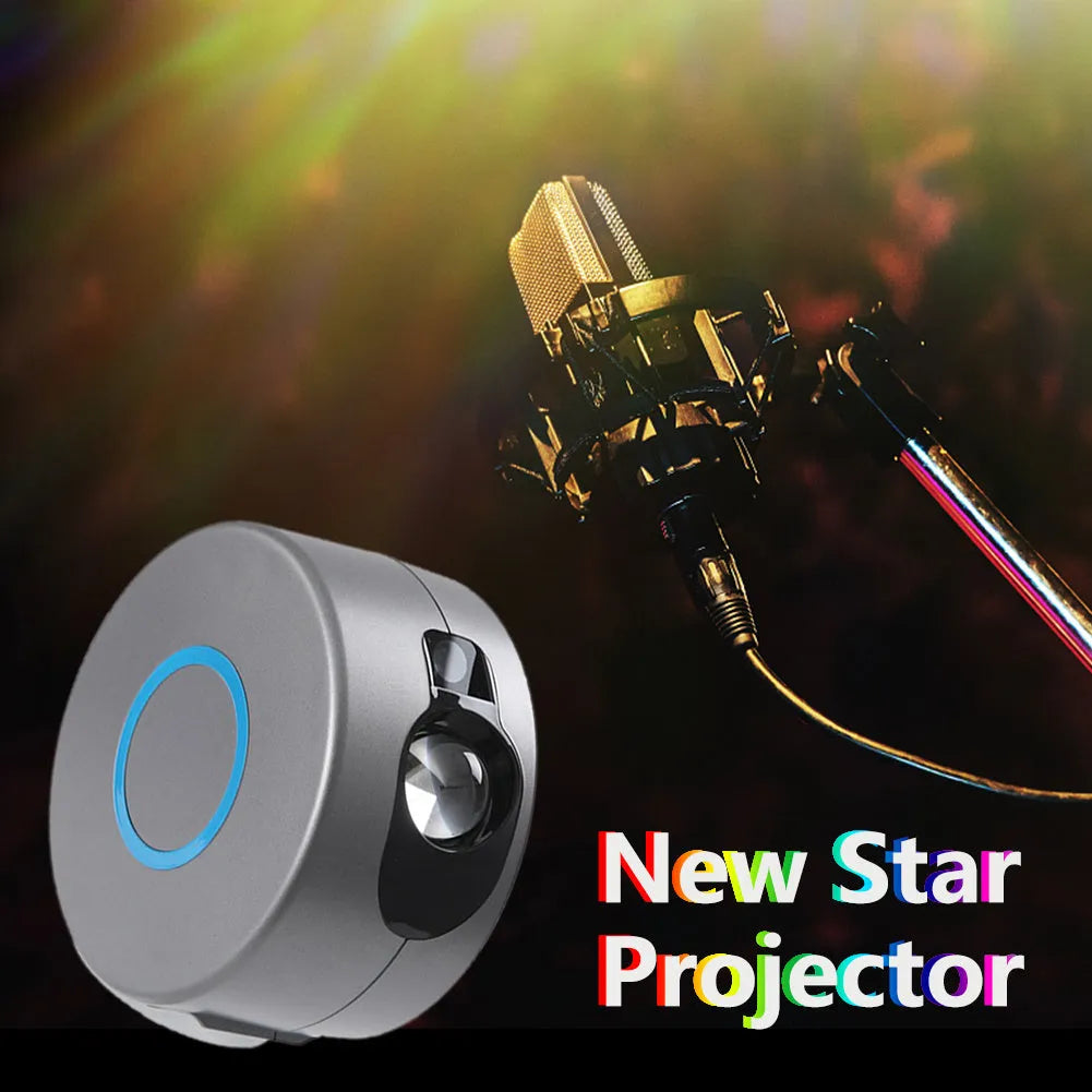 Grey starry sky projection lamp with remote control on a table, projecting light onto a ceiling.