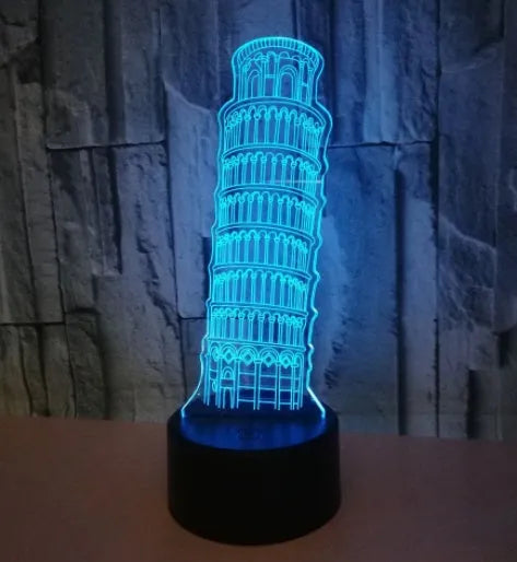 3D acrylic Leaning Tower of Pisa night light glowing in blue on a black base with remote control.
