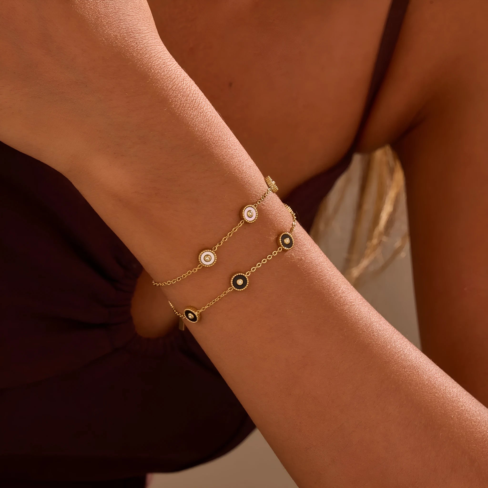 Geometric women's stainless steel bracelet with 18K gold electroplating alongside matching necklace