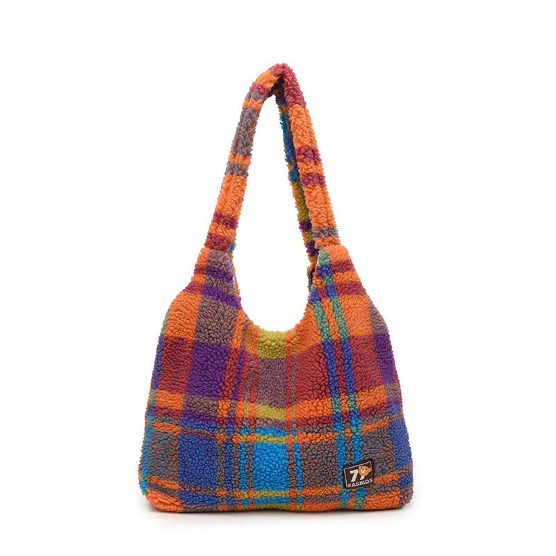 Women's plaid crossbody tote bag in soft plush fabric showing horizontal square shape and strapless shoulder strap