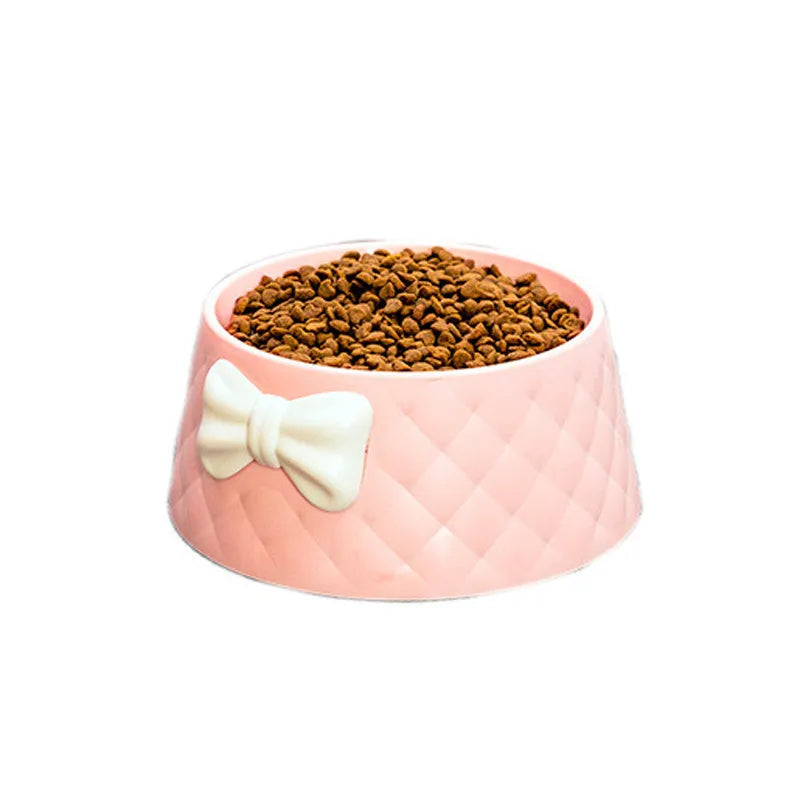Bow shaped pet feeding bowl in PP plastic available in pink, green, and grey