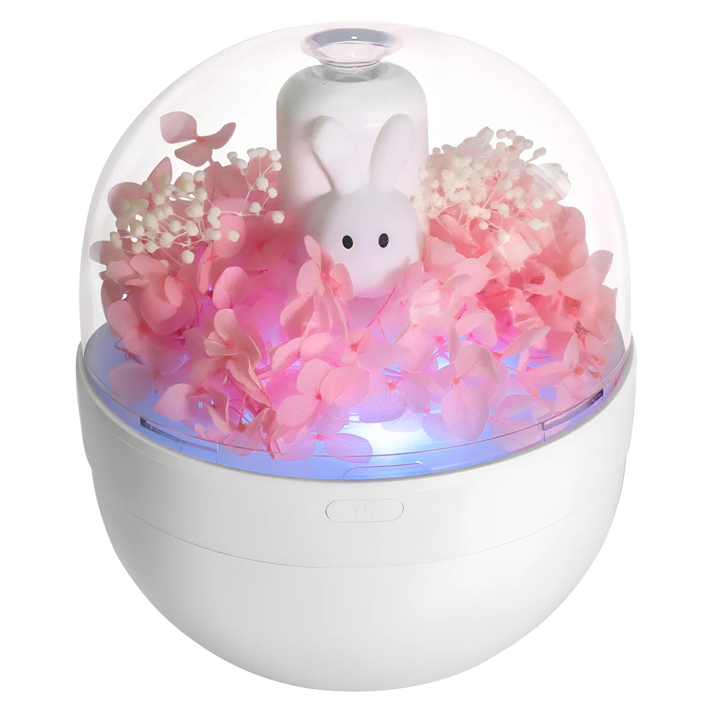 Pink Creative Rabbit aromatherapy humidifier with preserved flowers on top.