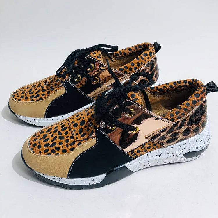 Women's casual suede sneakers with a wedge heel in black, leopard, pink, panther, and snake pattern colours.