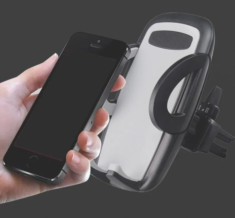 Black plastic universal mobile phone holder mounted on car air vent