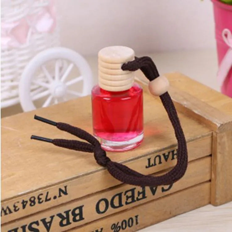 Glass bottle car air freshener hanging ornament with 55g fragrance options including lavender, lemon, apple, strawberry, ocean, and floral scents