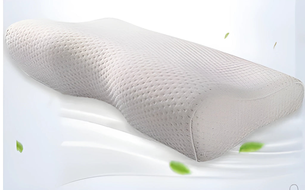 Blue butterfly-shaped memory foam cervical neck pillow on a bed