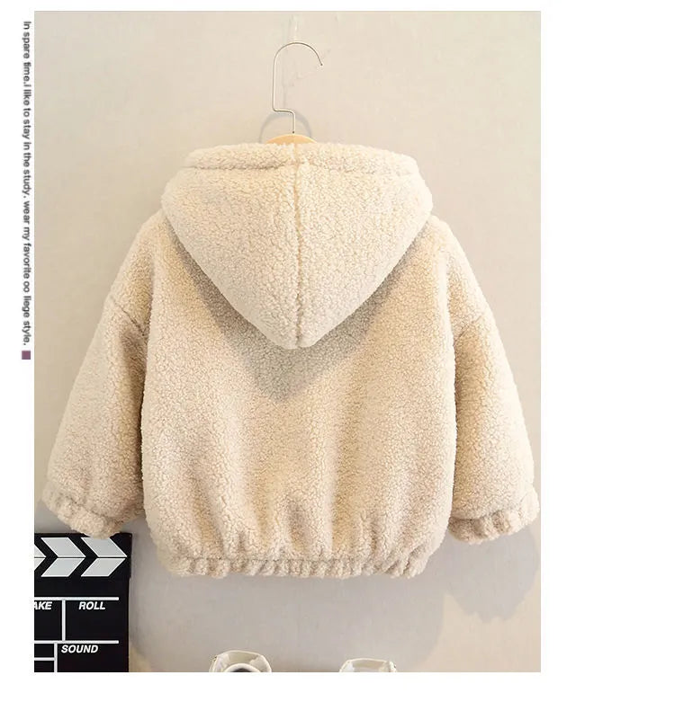 A child's beige fleece jacket with a cartoon pattern, featuring a hood and long sleeves.