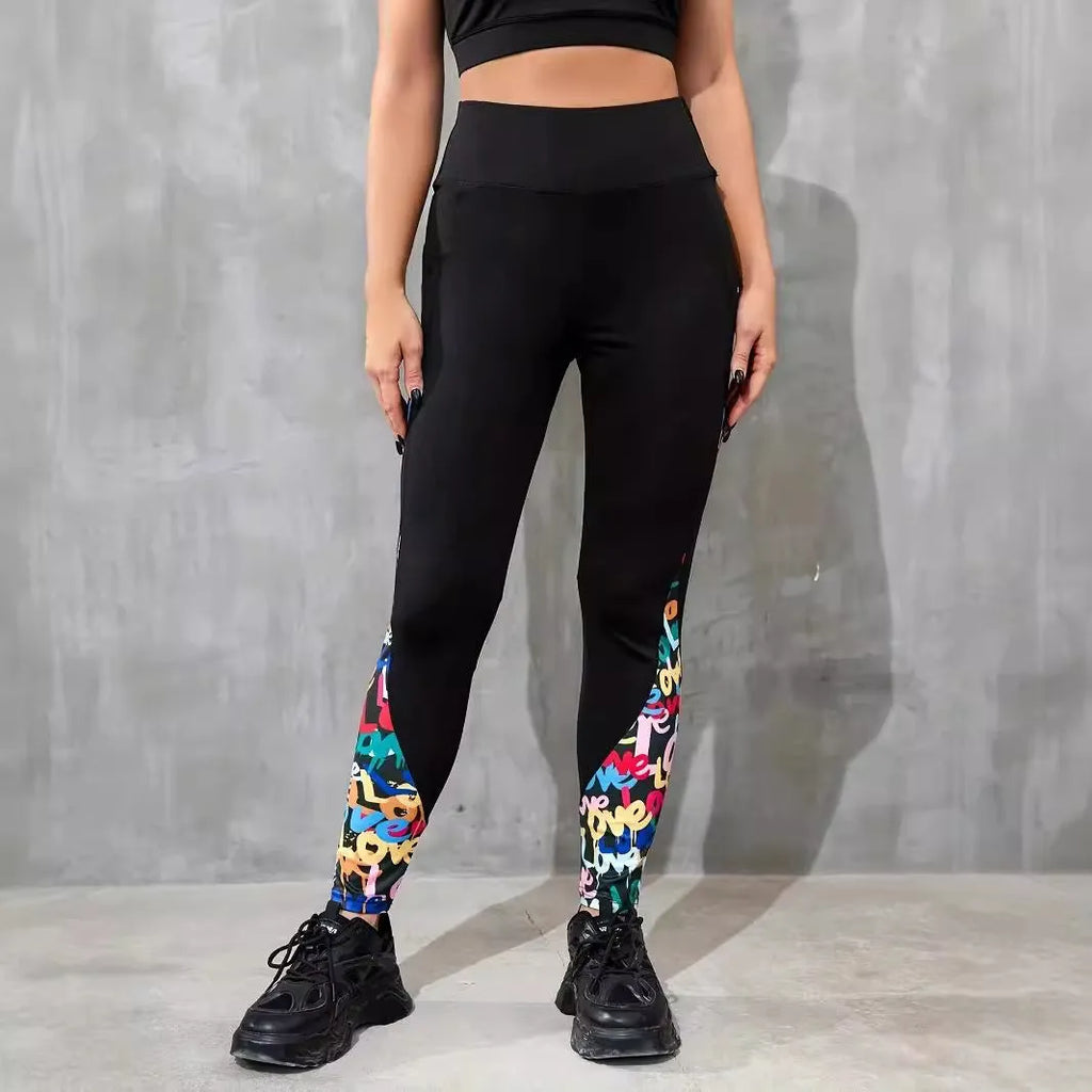 Women's black high-waisted cropped sports leggings with pocket detail and leopard print design