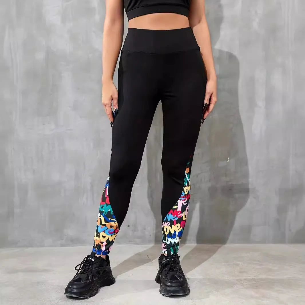 Women's black high-waisted cropped sports leggings with pocket detail and leopard print design