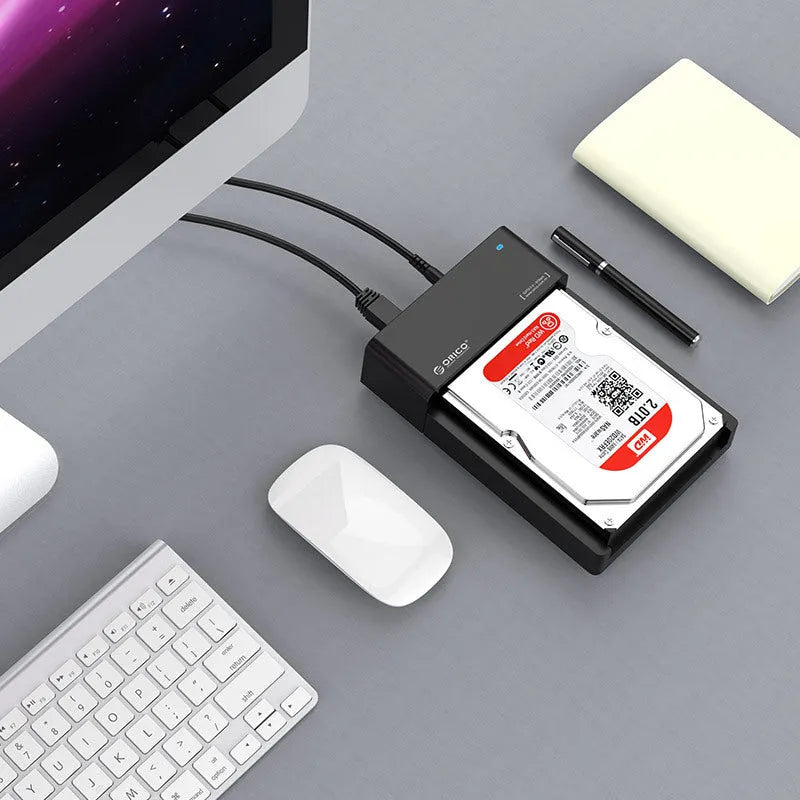 Black plastic 2.5-inch and 3.5-inch SATA hard drive enclosure with USB cable for portable storage conversion