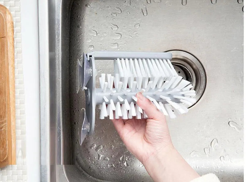 Grey double-head rotating cup brush with suction cups for wall mounting, length 17.5cm.