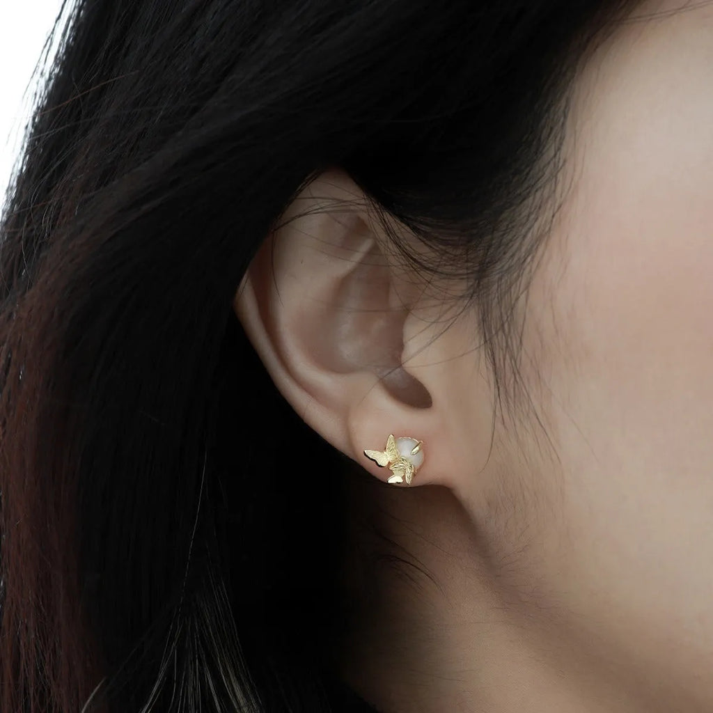 Original design butterfly ear studs in 925 silver with gold electroplated finish.