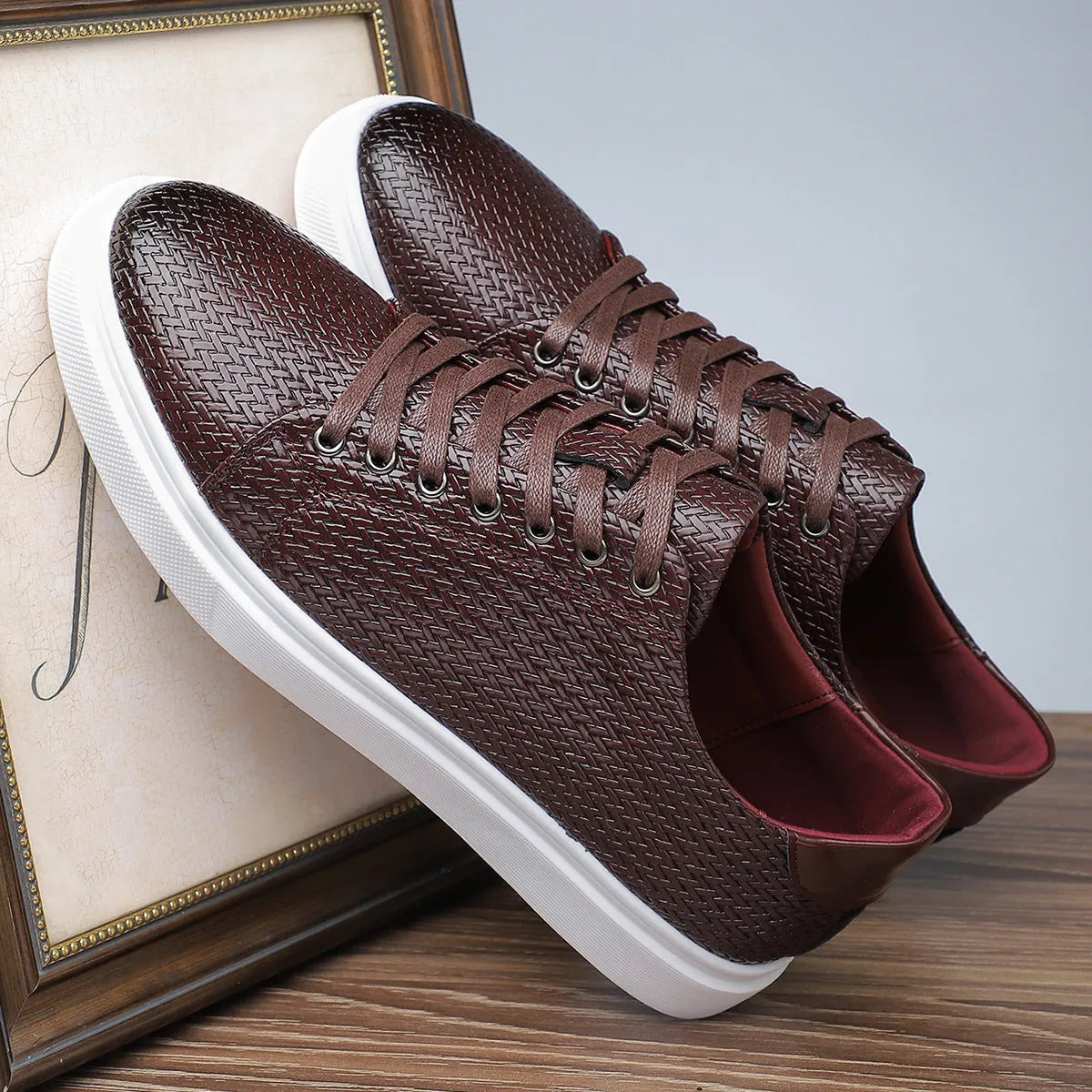 Men's black low-top business leather shoes with a rubber sole and stitching detail.