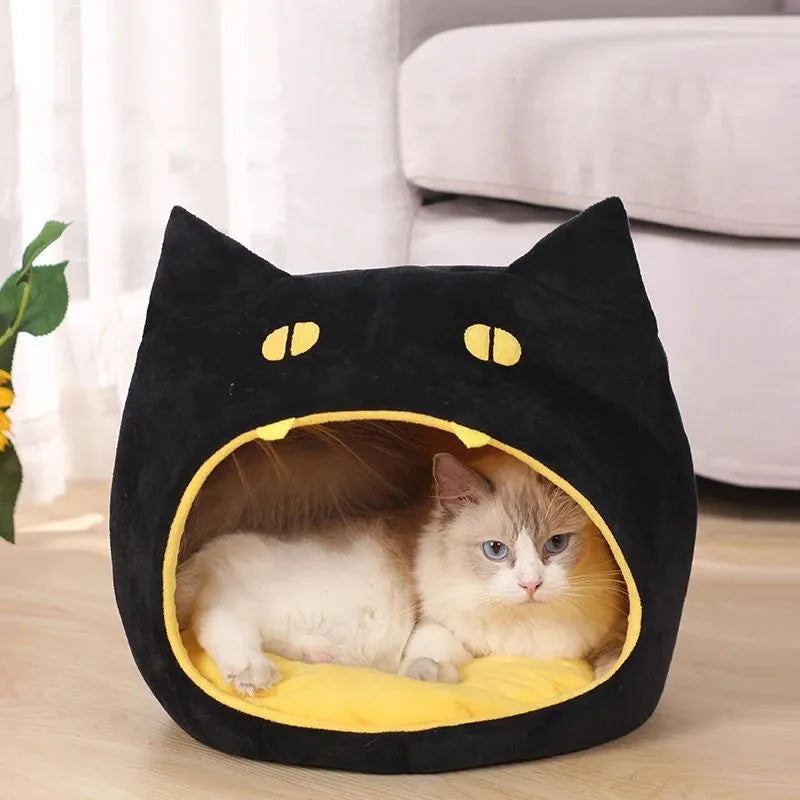 Soft plush covered cat cave bed with anti-slip bottom for cats and small dogs.