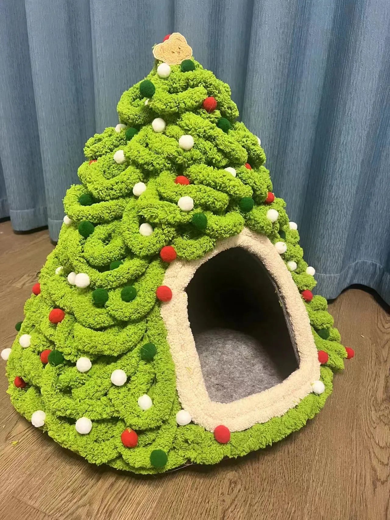 Grey cone-shaped felt cat house with tent-style enclosed design for indoor use