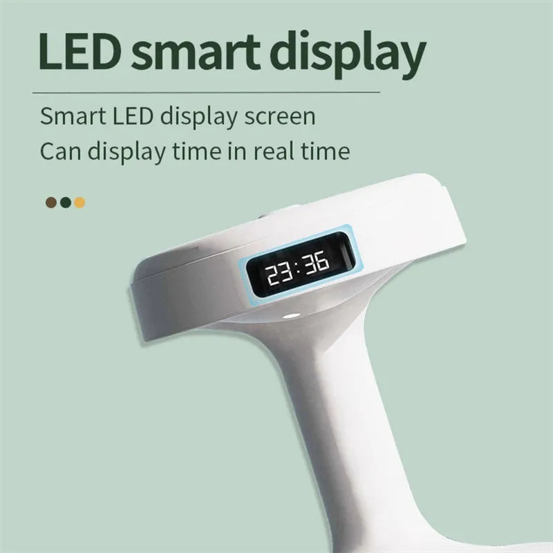 Bedroom anti-gravity humidifier with clock and backflow aroma diffuser in white plastic on desk with LED display