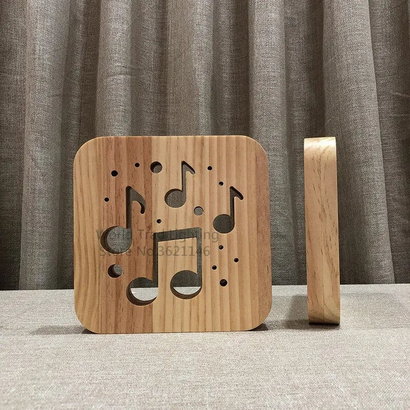Square pine wood USB-powered LED lamp emitting warm white 3D light on a table.
