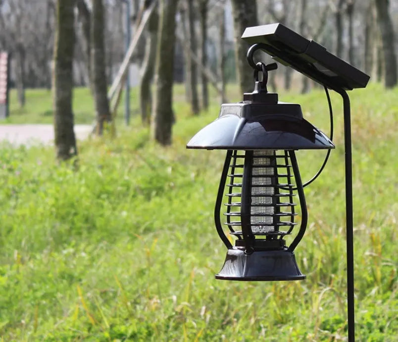 Black solar-powered electronic mosquito lamp with solar panel on top for outdoor garden use.