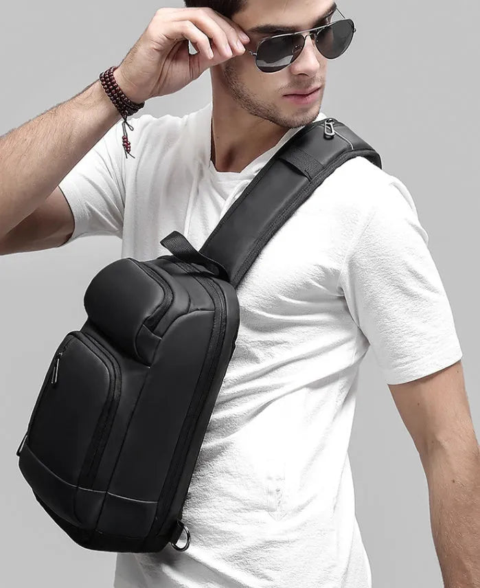 Black medium outdoor shoulder bag with air cushion strap and internal organisers