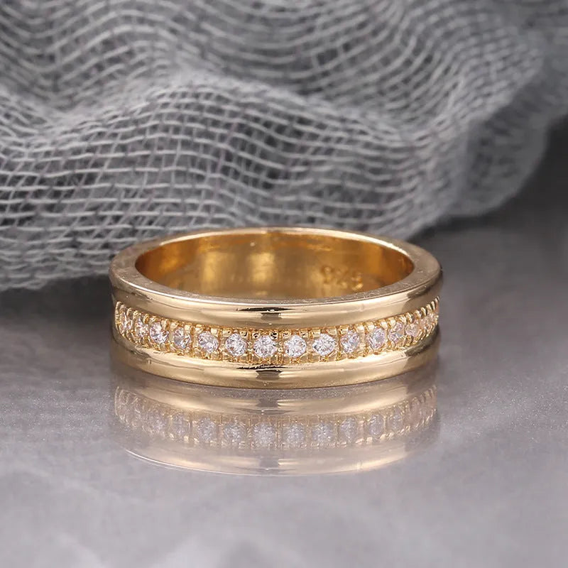 Gold plated geometric rhinestone ring with inlaid stone on white background, size options