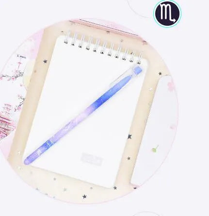 Boxed set of 12 constellation-themed quick-drying gel pens with plastic barrels.