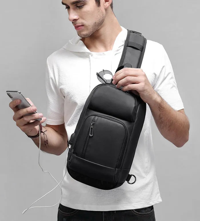 Black medium outdoor shoulder bag with air cushion strap and internal organisers
