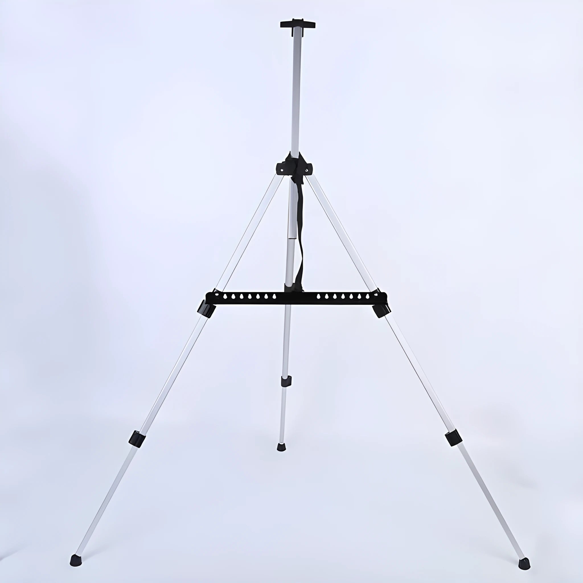 Silver aluminium alloy adjustable easel with metal tray in collapsed position on a tabletop