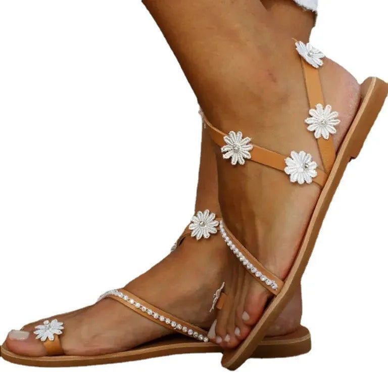 Brown women's Roman sandals with floral decoration and herringbone toe pattern