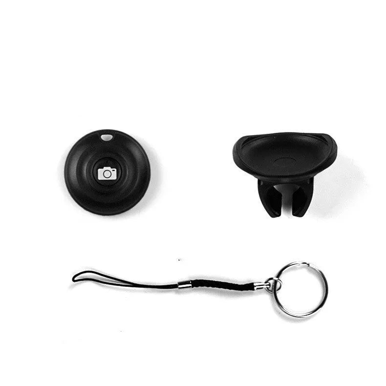 Black Snap Bluetooth remote control for wireless phone photography on a white background.