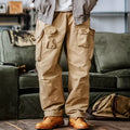 Men's corduroy cargo pants in khaki colour with multi-pockets, drawstring waist, and straight legs