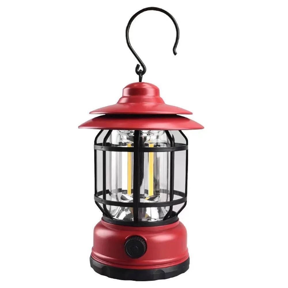 Portable camping lantern in dark green, black, or red colours, showing compact size with battery compartment.