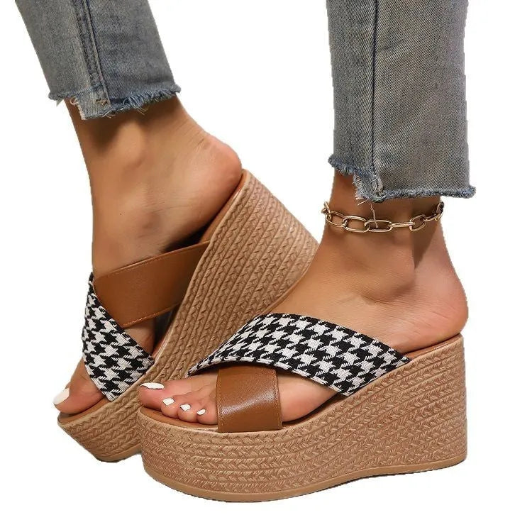 Brown and black plaid patterned casual wedge sandals with a rubber sole, shown on a white background.