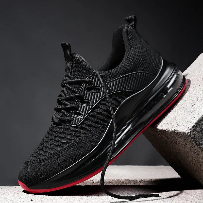 Men's low-top black mesh running shoes with rubber sole and lace-up front