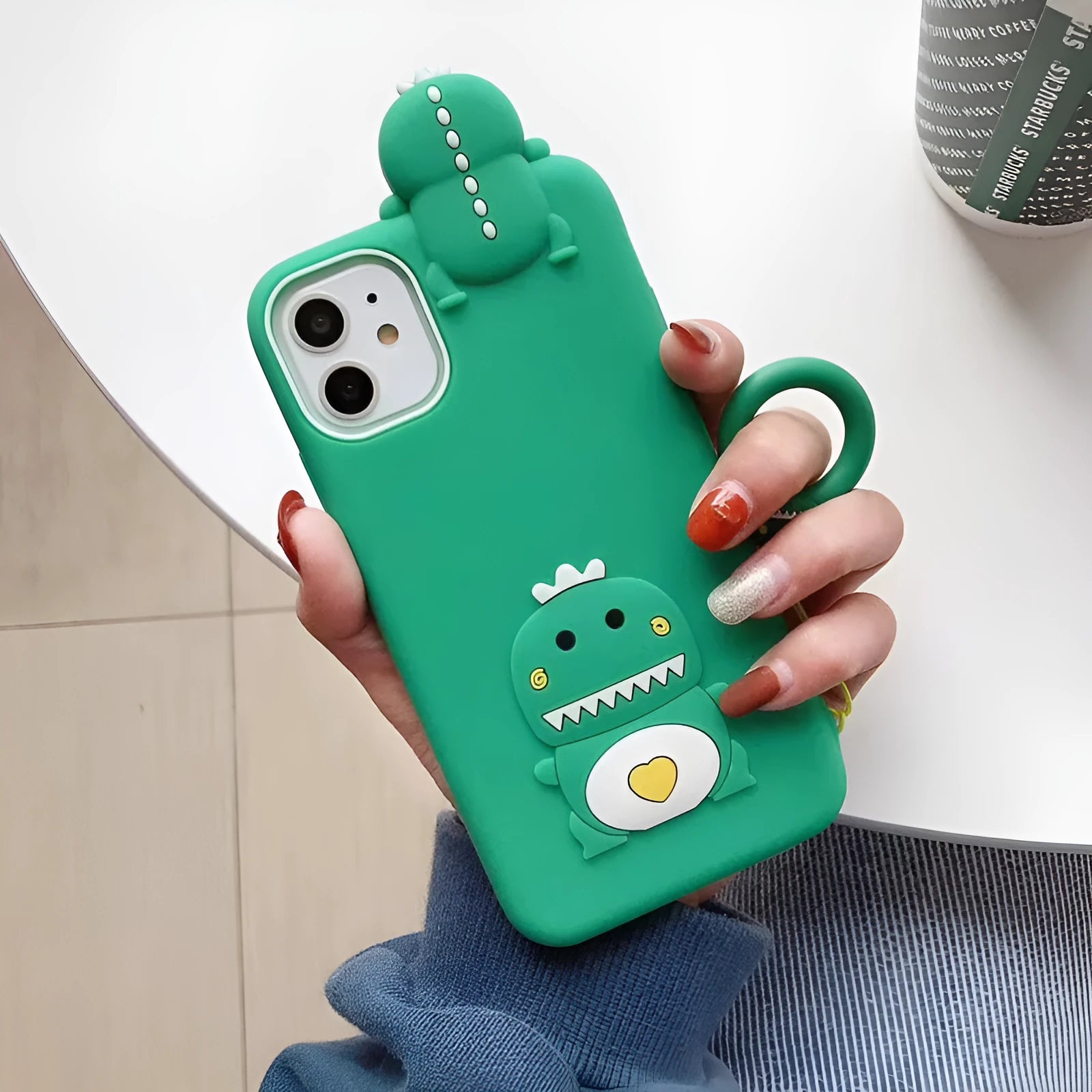 Green silicone iPhone case with cartoon animal design showing back cover style for drop protection