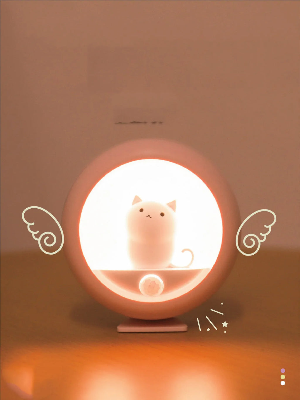 Colour-changing sleep night light with projection feature on a bedside table.