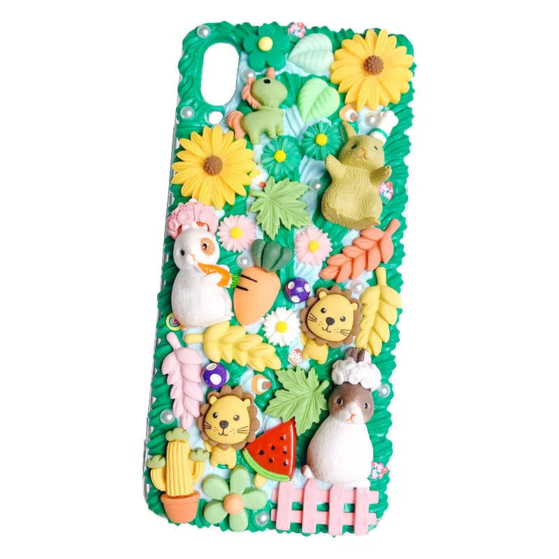Pink and green 3D silicone phone cases with raised cartoon rabbit designs for iPhone.