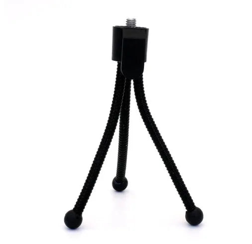 Small iron frame mini desktop tripod with folding legs and a ball head, shown alongside a camera.