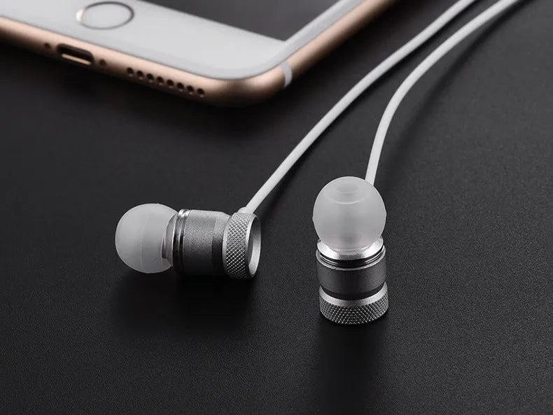 Close-up of in-ear music headphones with TPE cable in black, gold, pink and silver colour options.