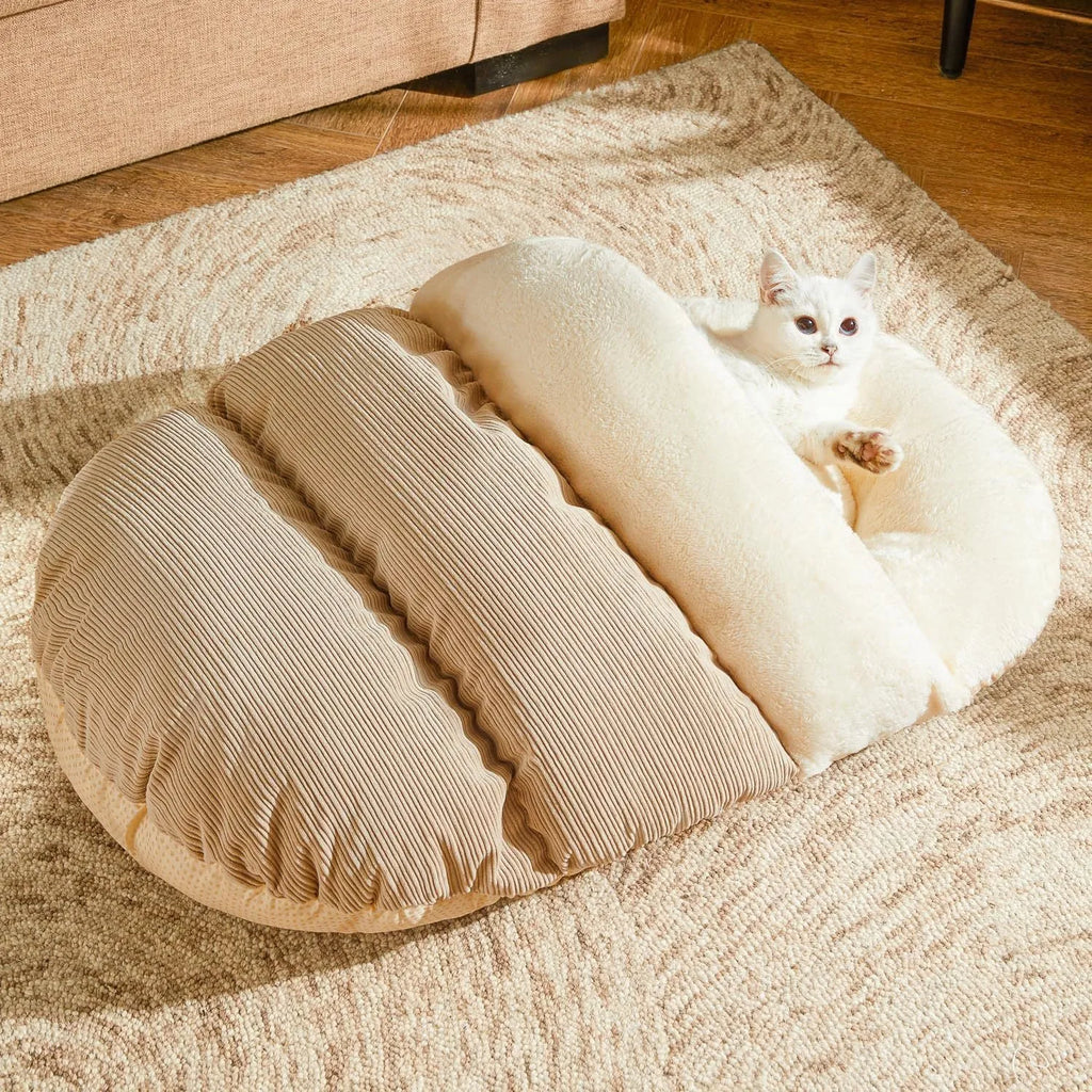 Grey corduroy slipper-shaped cat cave bed with plush interior, shown both as a closed hideout and opened as a flat lounging bed.